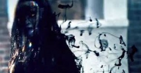 The Weeping Lady (Heather Lind) covered in a black lace veil on Sleepy Hollow.