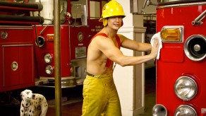 Shirless Mark Orlando poses as he cleans a fire truck on Burning Love