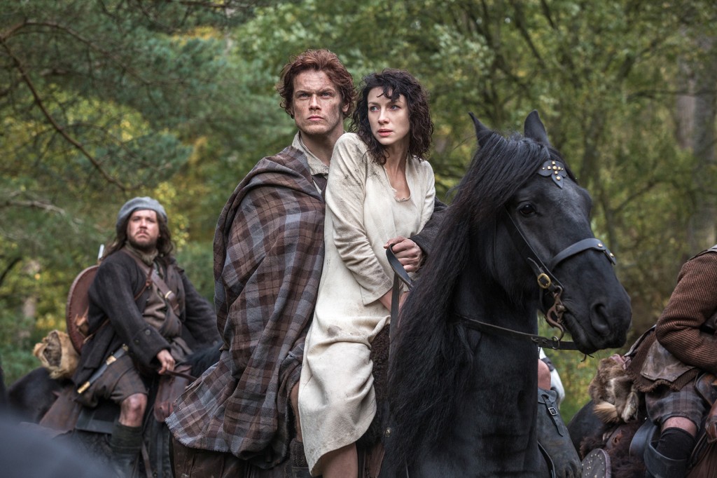 Outlander's Claire and Jamie on horseback