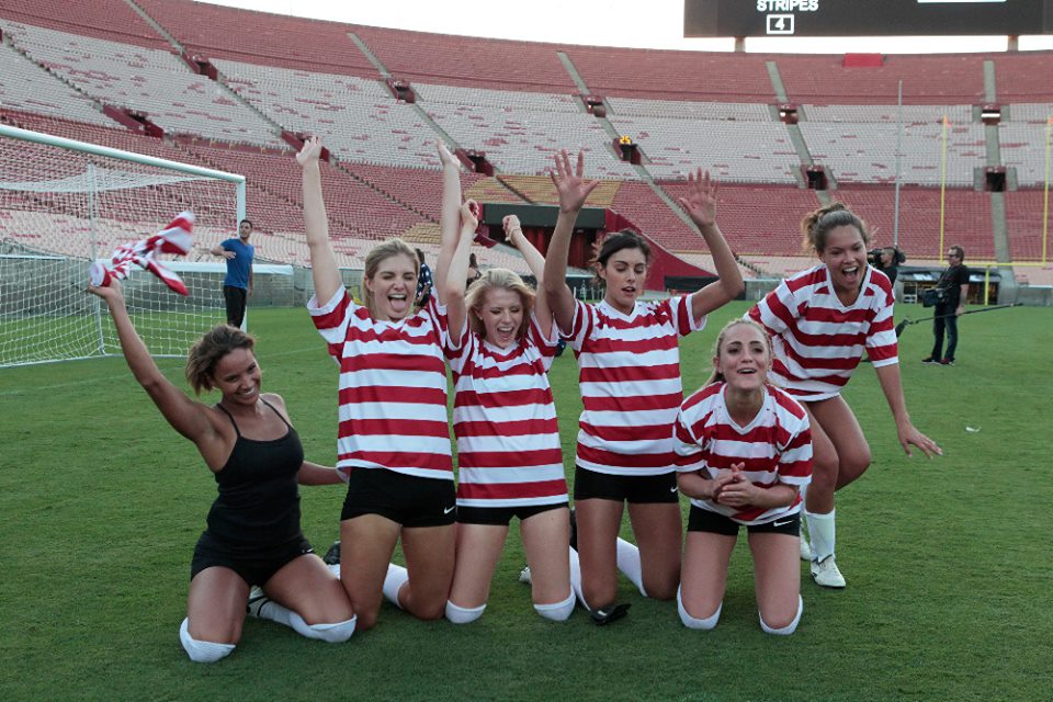 The Bachelor contestants on a soccer field