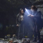 Ichabod and Abbie examine George Washington's bible in a cave on Sleepy Hollow