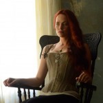 Katrina sits in a rocking chair on Sleepy Hollow