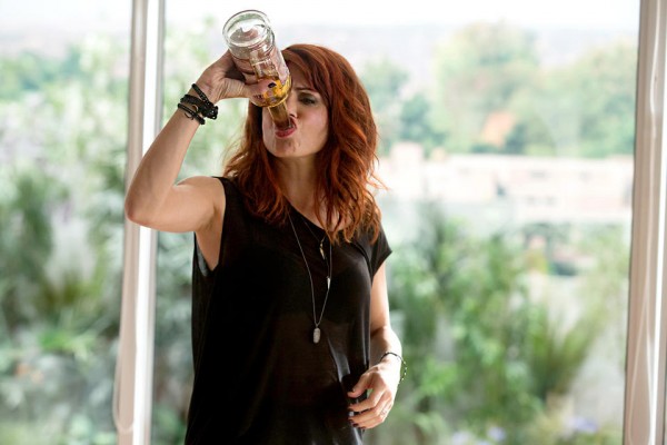 Jo drinks straight from bottle at Thanksgiving on Girlfriends' Guide to Divorce.