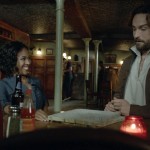 Ichabod (Tom Mison) and Abbie (Nicole Beharie) share drinks in the Sleepy Hollow, season premiere, "I, Witness."