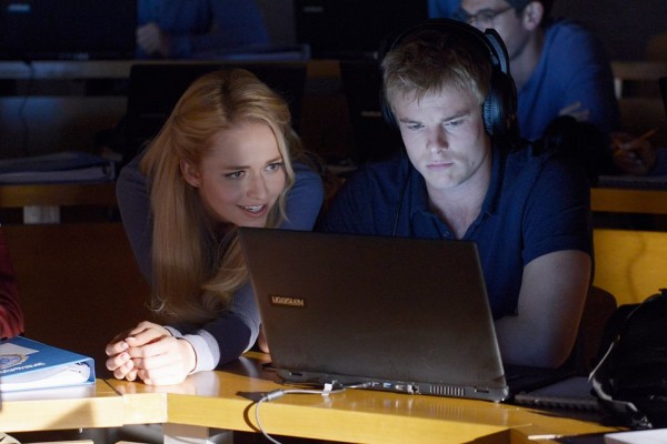 Shelby and Caleb look at a computer on Quantico